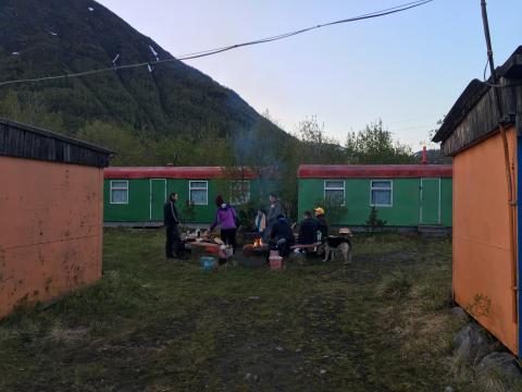 group of people around fire place