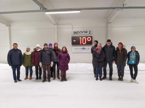 group of people on snow covered indoor road